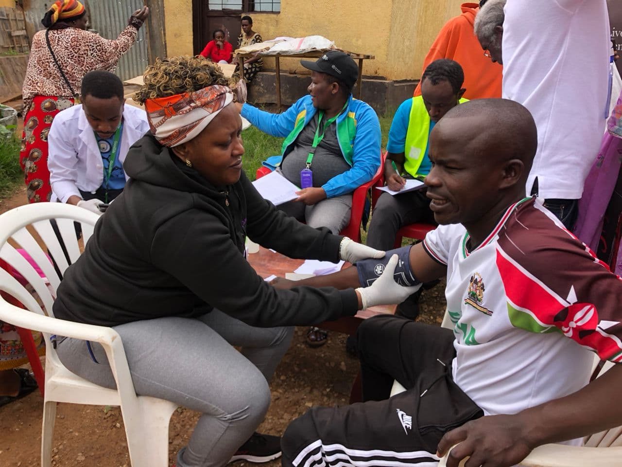 A blood pressure check at a community screening event.