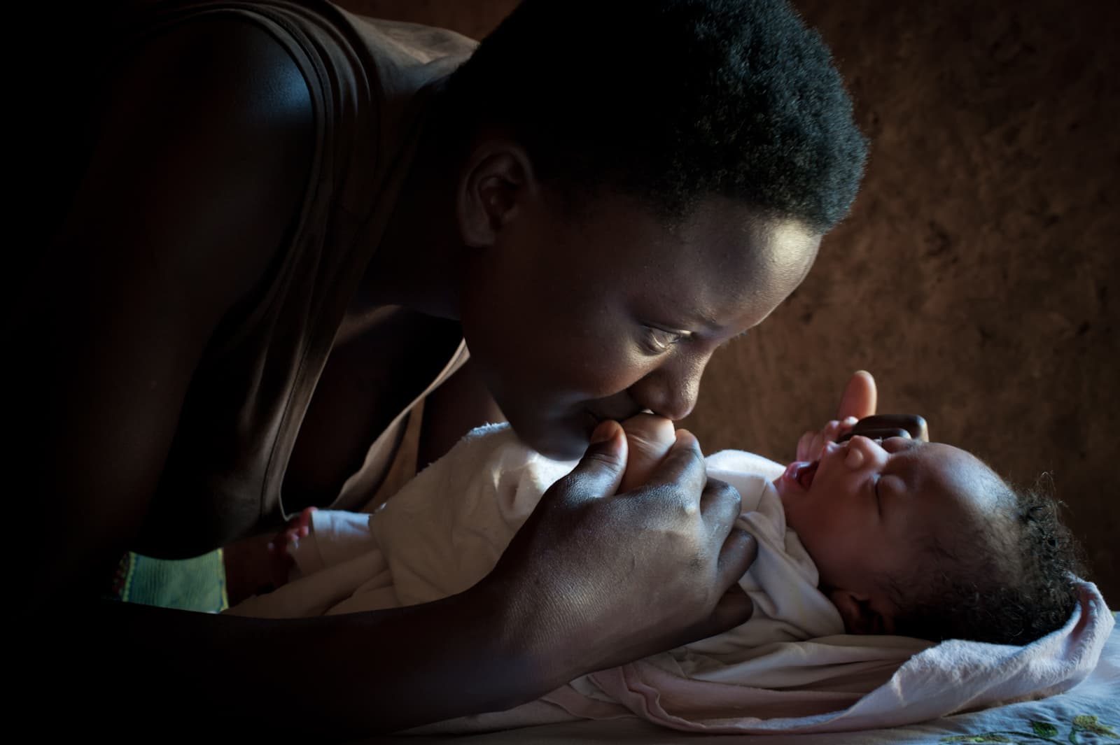 A mother holding her newborn.